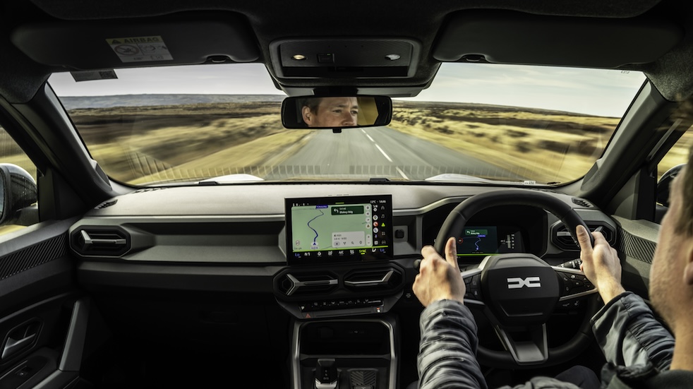 Internal shot of Sam Philip driving the Dacia Bigster